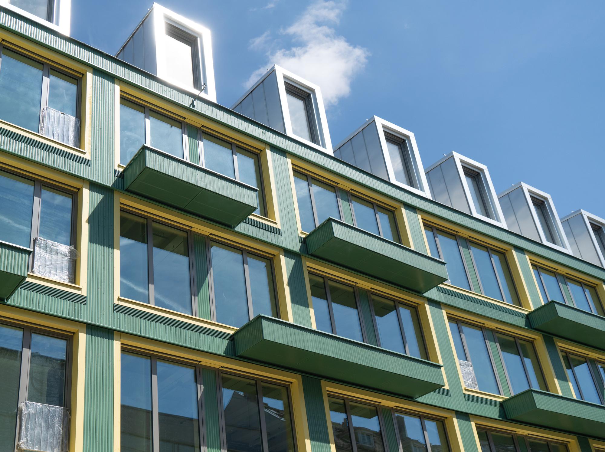 Detail of the green timber façade at the Vinzent residential and office building in Munich