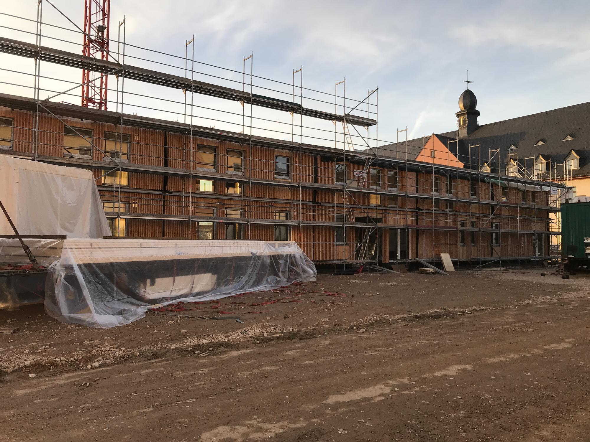 Installed prefabricated timber façade elements at Collegium Academicum Heidelberg